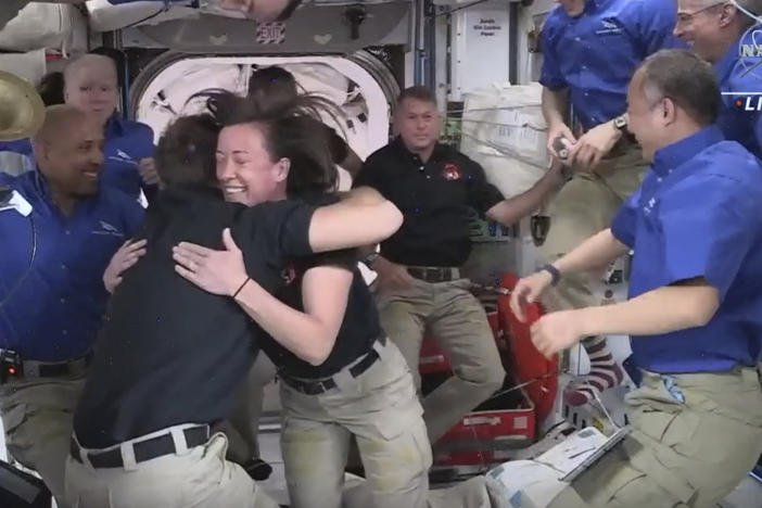 In this image provided by NASA, SpaceX astronauts are greeted by those already aboard the International Space Station after the Dragon capsule successfully docked on Saturday. Their arrival brings the total number of astronauts on the station to a recent high of 11.