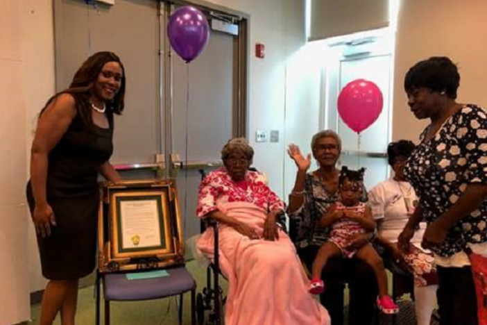 Hester Ford (center) celebrates her birthday in 2019 with her family members. Ford died last Saturday at 115 or 116.