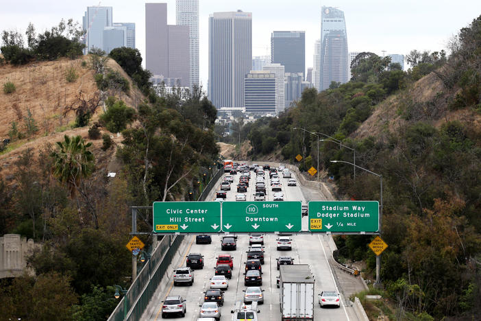 Cars make their way toward downtown Los Angeles on Thursday. California could regain the right to set its own vehicle emissions standards after the Environmental Protection Agency announced it was moving to curb a Trump-era policy that sought to erode the state's previously held power.