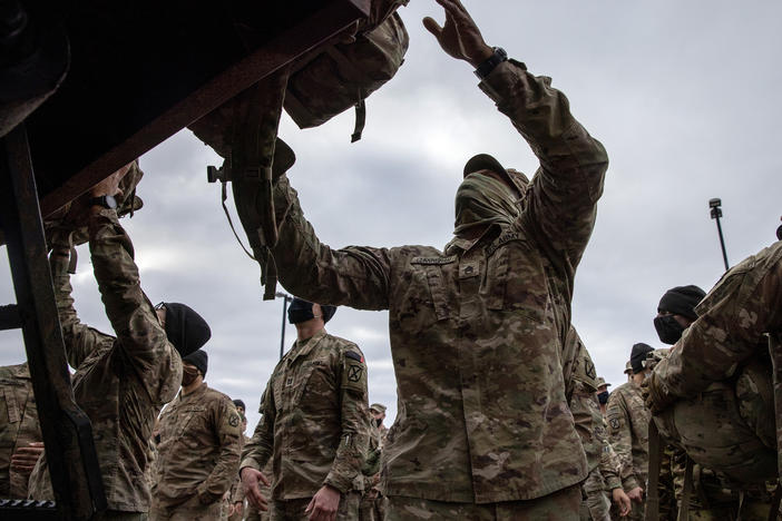 U.S. Army soldiers retrieve their duffel bags after they returned home from a 9-month deployment to Afghanistan on December 10, 2020 at Fort Drum, New York. Earlier this month, President Biden announced that the U.S. would withdraw all its troops from Afghanistan by Sept. 11, 2021