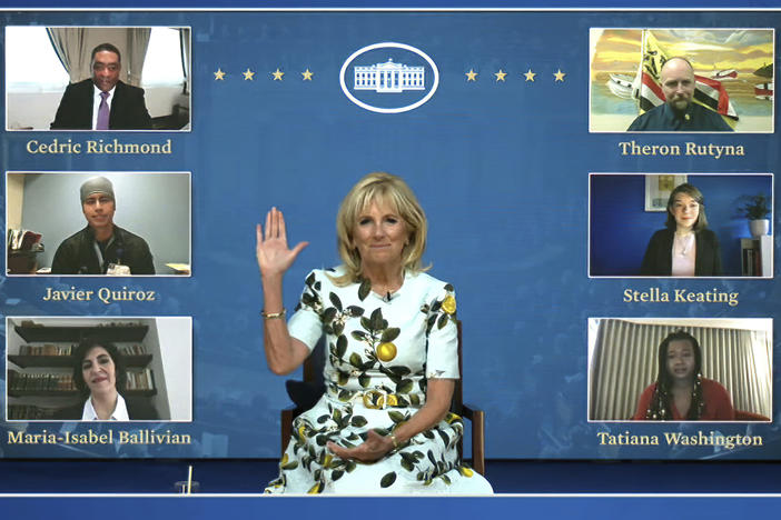 An image from video provided by the White House shows first lady Jill Biden meeting with her virtual guests ahead of President Biden's joint address on Wednesday. Many Democratic lawmakers are also naming guests of honor, who will be watching the speech remotely.