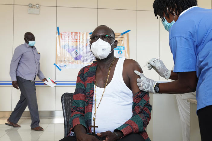A bishop receives a vaccine for COVID-19 at Juba Teaching Hospital on April 7 in Juba, South Sudan. South Sudan received 132,000 doses of the Oxford-AstraZeneca vaccine on March 25 through the World Health Organization's COVAX program to ensure all countries have equal access to vaccines.