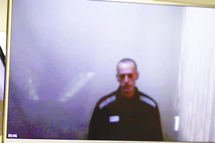 In this photo taken from a video provided by the Babushkinsky District Court in Moscow on Thursday, Russian opposition leader Alexei Navalny is seen during a hearing on charges of defamation.
