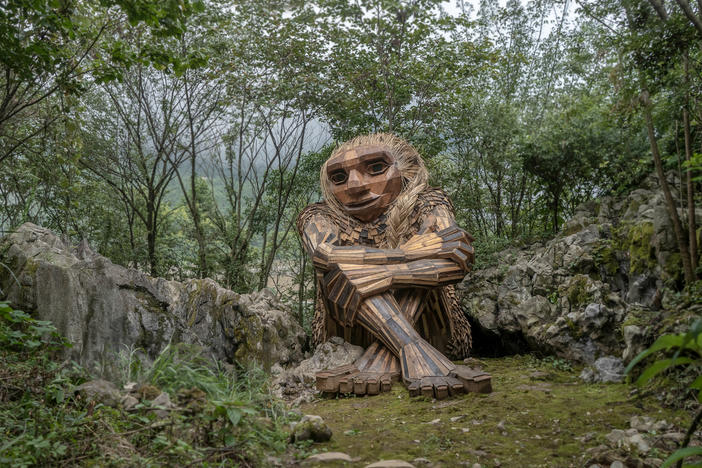 "Recycle art activist" Thomas Dambo makes gentle giants from scrap wood, old pallets, twigs and debris. Above, the troll Marit in<em> It Sounded Like a Mountain Fell</em> in Wulong, China.