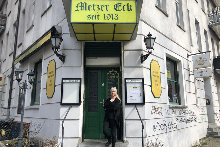 Sylvia Falkner stands in front of her Berlin pub, Metzer Eck, which has been owned by four generations of the same family since 1913. She is one of thousands of small German business owners struggling to keep their businesses open in an extended pandemic lockdown.