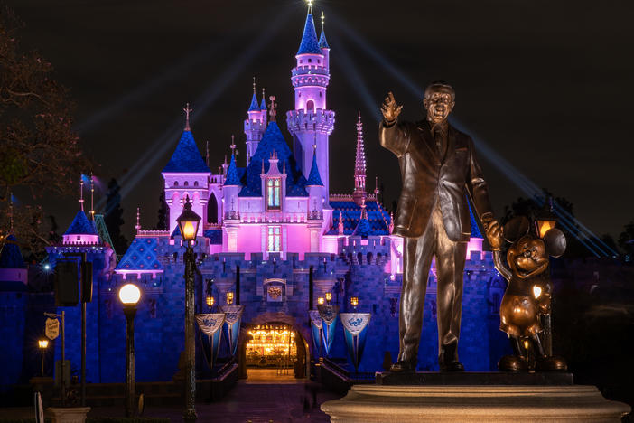 Disneyland's Sleeping Beauty Castle is lit up this week as the theme park prepares to reopen on Friday. California health restrictions allow the resort to operate at 25% capacity.