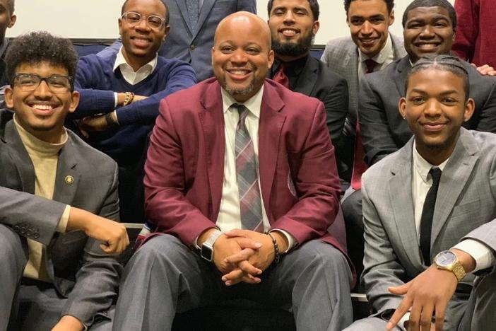 Members of the Morehouse College speech and debate team at the 2019 Pi Kappa Delta National Championship at Hofstra University. Coach Kenneth Newby is seen at the center, and student debater Daniel Edwards is at front left.