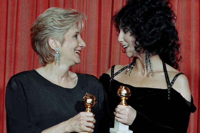 Olympia Dukakis and Cher hold the Golden Globe awards they received for performances in the hit movie <em>Moonstruck</em> in 1988. Later that awards season, they both won Oscars.