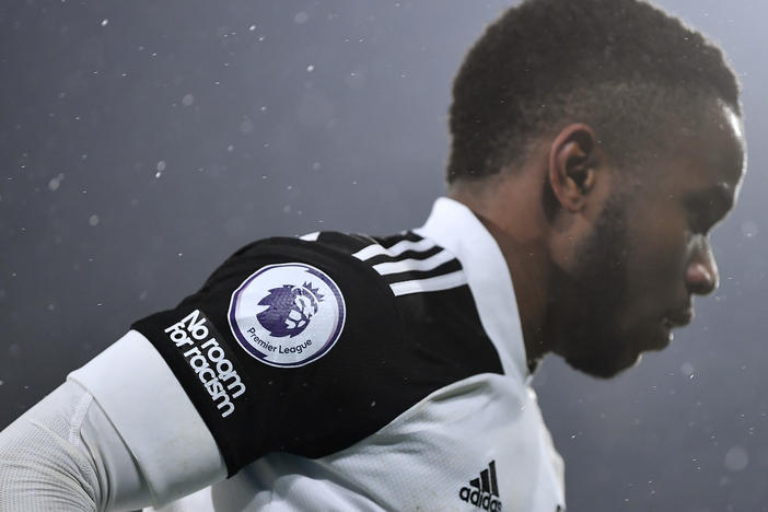 A "No room for racism" logo and Premier League logo is seen on the shirt of Ademola Lookman of Fulham during the Premier League match.