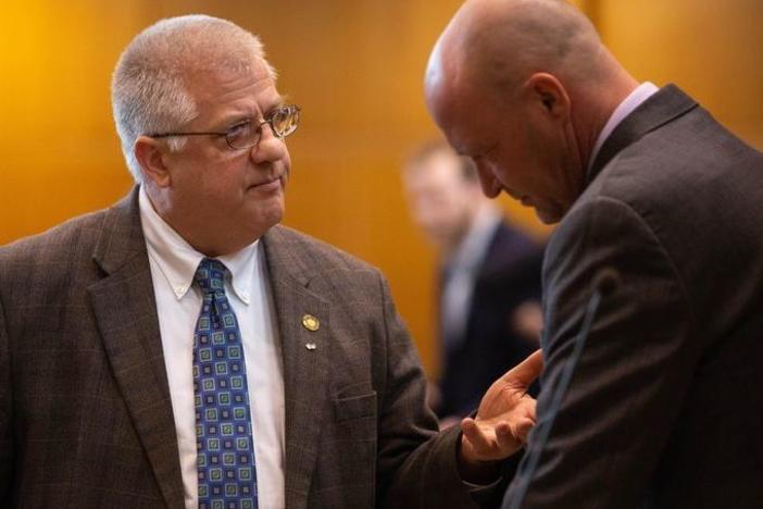 Rep. Mike Nearman, R-Polk County, chats with fellow representatives on the House floor on April 11, 2019, at the Capitol in Salem, Ore. He faces criminal charges after allowing far-right demonstrators to breach the state Capitol in December 2020.