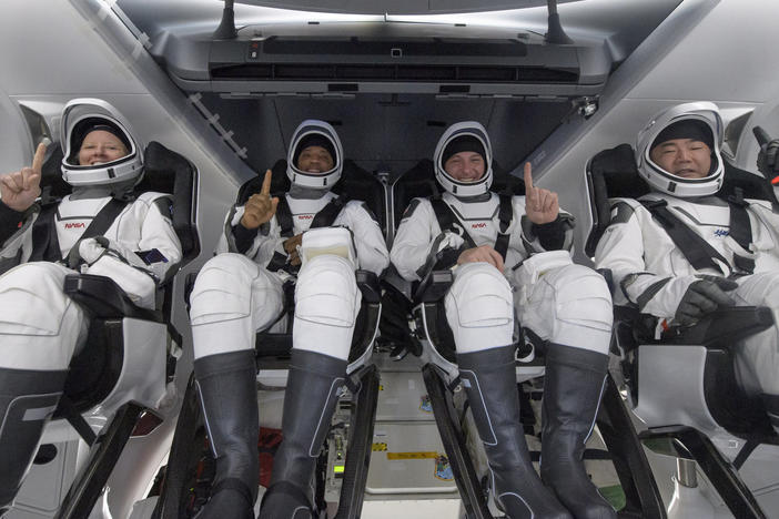 NASA astronauts Shannon Walker (left), Victor Glover, and Mike Hopkins, along with Japan Aerospace Exploration Agency astronaut Soichi Noguchi, are seen inside the SpaceX Crew Dragon Resilience spacecraft onboard the SpaceX GO Navigator recovery ship shortly after landing in the Gulf of Mexico off the coast of Panama City, Fla., on Sunday.