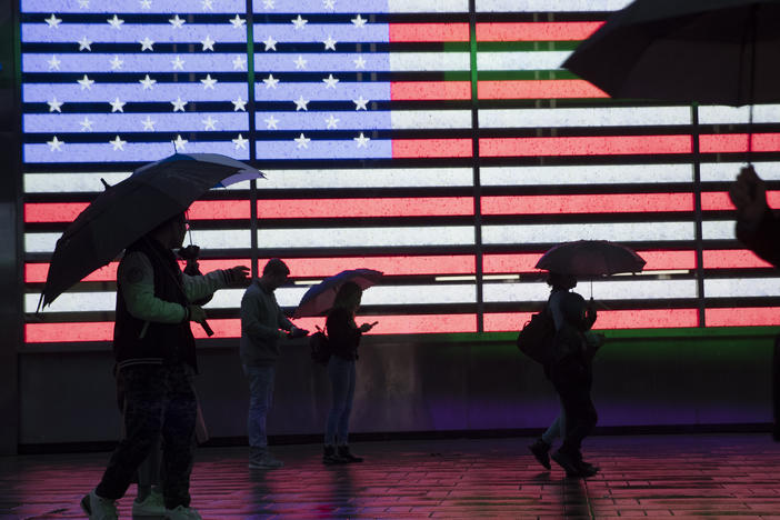People holding umbrellas walk through New York City's Times Square in 2019. The U.S. Census Bureau plans to change how it protects the confidentiality of people's information in the detailed demographic data it produces through the 2020 count.