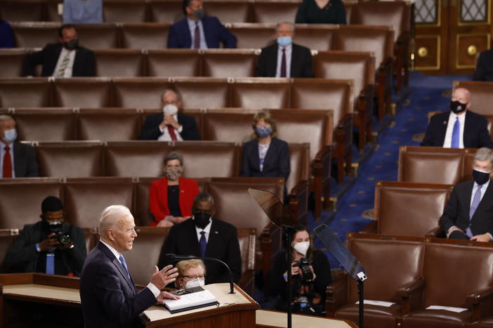 WASHINGTON, DC - APRIL 28: President Joe Biden addresses a Joint Session of Congress, with Speaker of the House Nancy Pelosi and Vice President Kamala Harris behind, on Capitol Hill in Washington DC.