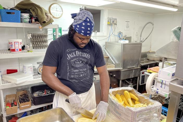 Jason Brissett, a kitchen worker who came to the U.S. last month from Jamaica through an H-2B visa, is bracing for 80-hour workweeks this summer to make up for staffing shortages.