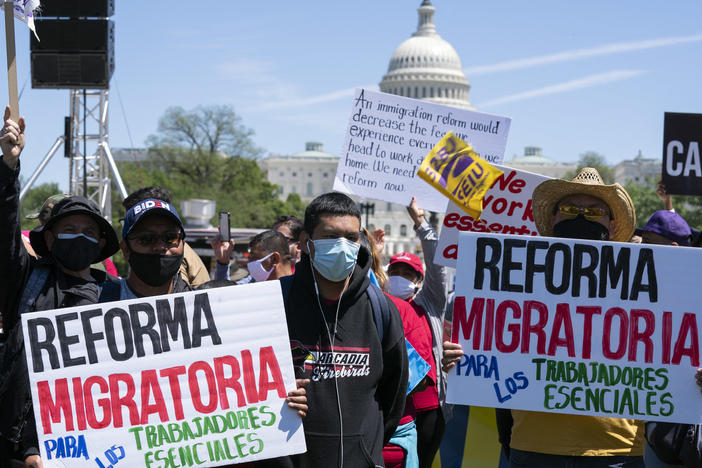 Immigration rights supporters rally Saturday on the National Mall in Washington, D.C., demanding citizenship for essential workers.
