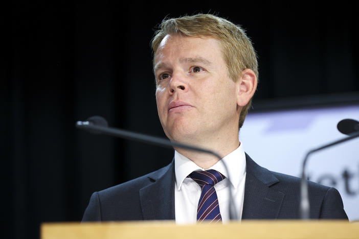 New Zealand Minister for COVID-19 Response Chris Hipkins looks on during a news conference at Parliament last month where he and Prime Minister Jacinda Ardern announced plans for a quarantine-free "travel bubble" between New Zealand and Australia.