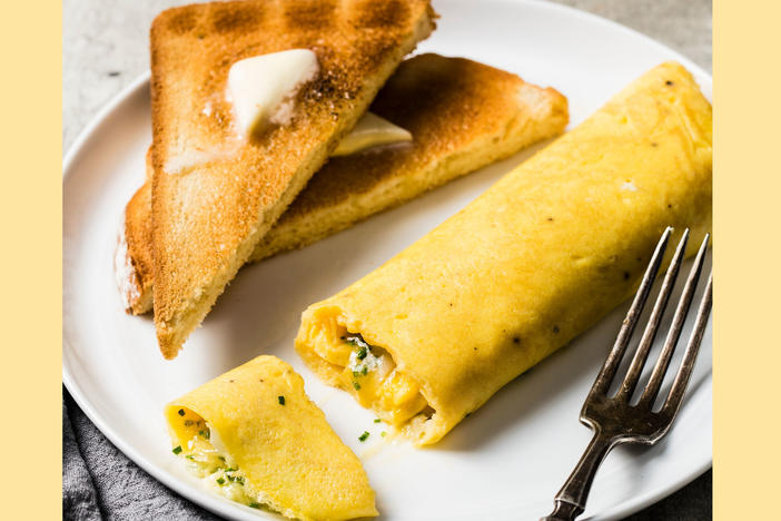A French omelet, unlike its diner-style counterpart, is rolled, not folded, and include very little filling like vegetables and meats.