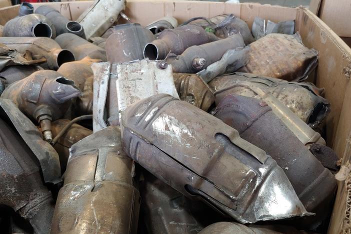 A bin full of discarded catalytic converters at AB CatTech in Burlington, Wis.