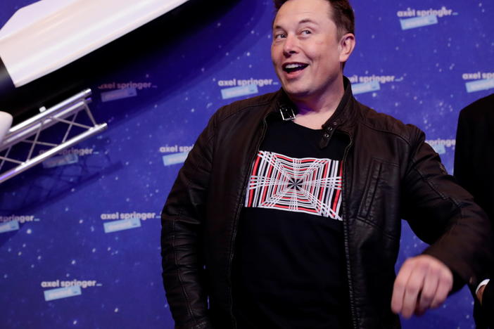 Tesla CEO Elon Musk strikes a pose at a December 2020 awards ceremony in Germany. This weekend, he hosted NBC's <em>Saturday Night Live</em>.