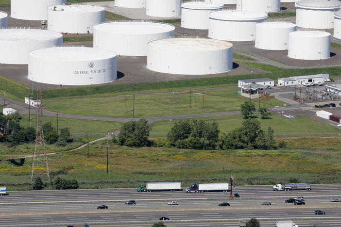Traffic on I-95 passes oil storage tanks owned by the Colonial Pipeline Co. in Linden, N.J. An cybersecurity attack has shut down Colonial Pipeline, a major transporter of gasoline along the East Coast.