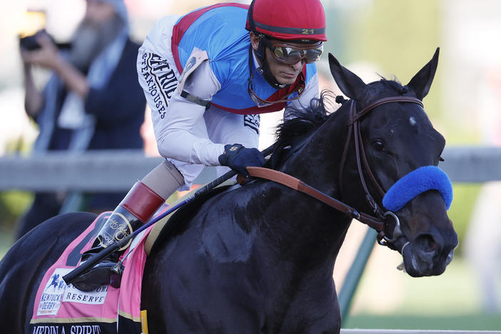 Medina Spirit, ridden by jockey John Velazquez, leads the field  during the Kentucky Derby in Louisville on May 1. On Sunday, trainer Bob Baffert revealed the Derby winner had failed a drug test.