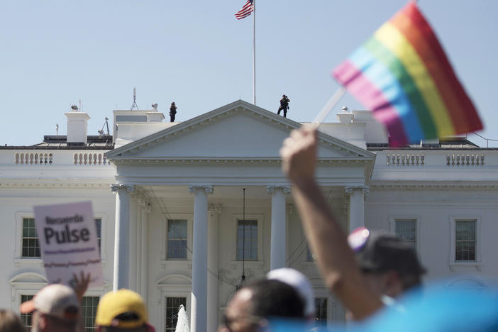The Biden administration says the government will protect gay and transgender people against sex discrimination in health care. In this 2017 photo, Equality March for Unity and Pride participants march past the White House in Washington.