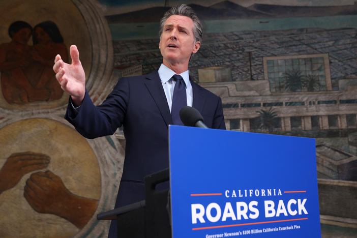 California Gov. Gavin Newsom speaks during a press conference in Oakland, Calif., on Monday where he announced a new round of $600 stimulus checks residents making up to $75,000 a year. Newsom also announced a projected $75.7 billion budget surplus compared to last year's projected $54.3 billion shortfall.