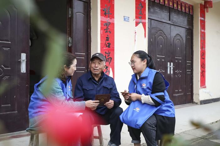 Workers in China collect demographic data in the the seventh population census on Nov. 1, 2020.