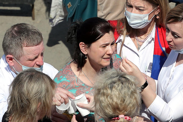 Relatives of students who attend a school in the Russian city of Kazan, where a gunman opened fire on Tuesday, killing several students and at least one teacher and injuring more than 20 others.