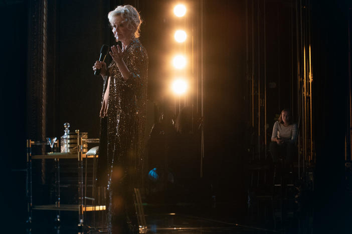 L to R: Legendary comic Deborah Vance (Jean Smart) performs while her reluctant assistant Ava (Hannah Einbinder) literally waits in the wings on <em>Hacks</em>.