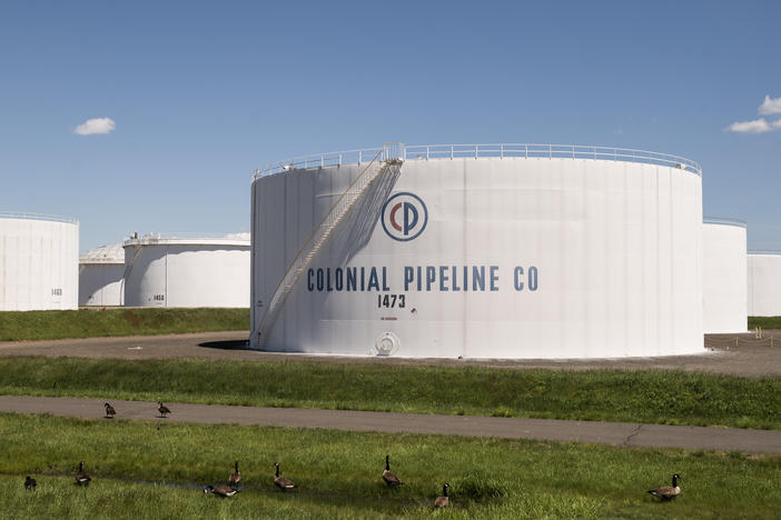 President Biden alluded to the Colonial Pipeline cyberattack in his new executive order. Here, storage tanks at a Colonial Pipeline facility are seen Wednesday in Avenel, N.J.