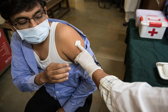 Amit Sonawane, 35, an engineer at a district health office, gets his first vaccine dose in Palghar, India.