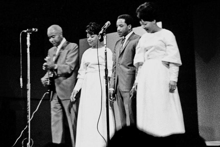 Pervis Staples, second from right, performing with his family in 1965.