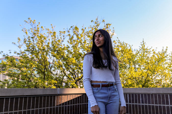 NPR Student Podcast Challenge winner Kriti Sarav poses for a portrait while on the top balcony of her family's home in Chicago.