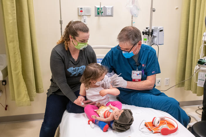 Eloise LaCour, 3, gets her COVID-19 vaccination as part of Phase 1 clinical trials on use of the Pfizer-BioNTech vaccine in children 5 and younger.