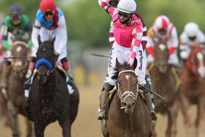 Jockey Flavien Prat, #6, riding Rombauer, celebrates as he wins the 146th running of the Preakness Stakes at Pimlico Race Course on Saturday in Baltimore.