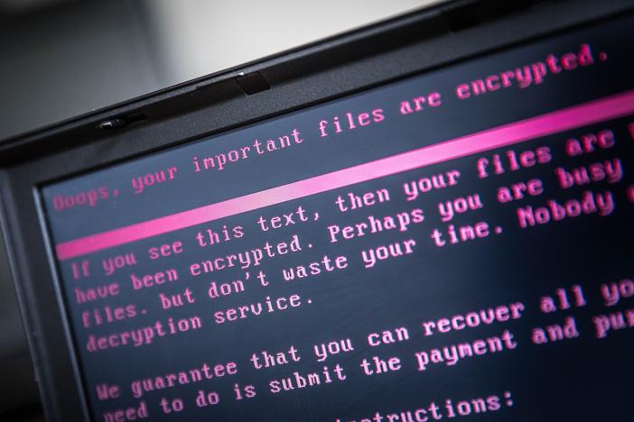 A laptop displays a message after being infected by ransomware in 2017. Thousands of institutions  in the U.S. fall victim to ransomware attacks each year.