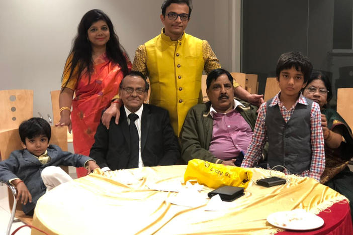 Richa Srivastava (rear left) with her husband, Shalabh Pradhan (rear right), and their two fathers, Sudheer Kumar Pradhan (front left) and Sheo Prakash Srivastava (front right), in an undated family photo. The two family patriarchs died within three days of one another in April.