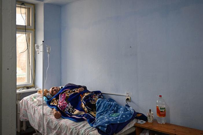 A patient rests at the COVID ward of the regional hospital in Leova, Moldova, on March 23. Moldova remains one of the poorest countries in Europe and has relied on vaccine donations from Romania and COVAX, a program that aims to distribute the world's vaccines more equitably.