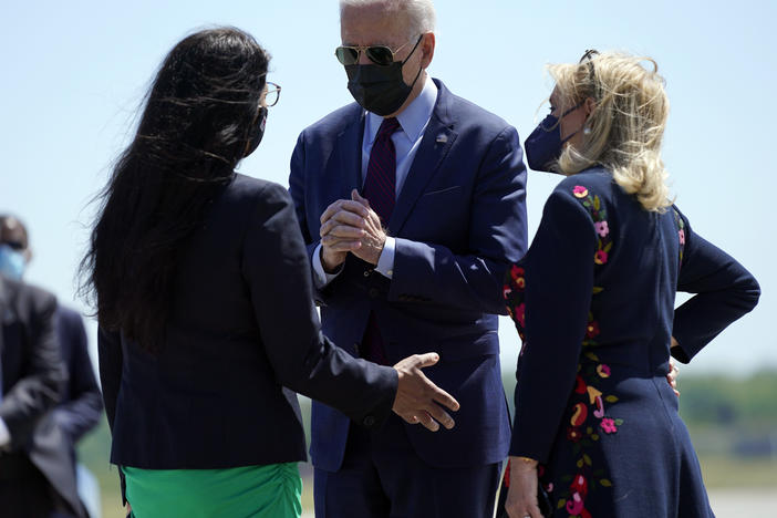 President Biden speaks with Reps. Rashida Tlaib (left) and Debbie Dingell on Tuesday after arriving in Detroit. Tlaib, a progressive Democrat and the first Palestinian American woman in Congress, expressed her opposition toward U.S. policy with Israel to Biden.