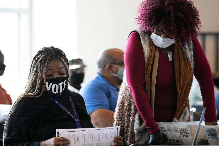 Fulton County workers count absentee ballots on Nov. 6, 2020, in Atlanta. A judge's order marks the latest challenge for the county in a seemingly never-ending election cycle.