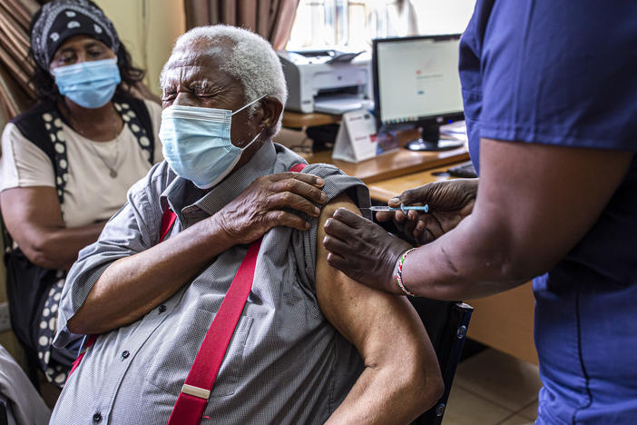 An older person receives their first dose of the AstraZeneca vaccine in Thika, Kenya. The vaccine's manufacturer, Serum Institute of India, announced this week that it will freeze all exports of the vaccine through the end of this year — leaving 20 million people in Africa without a source for their second dose.