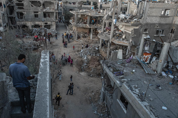 Palestinians inspect the rubble of their destroyed houses in Beit Hanun, northern Gaza Strip, on Saturday. The ceasefire between Israel and Hamas appeared to be holding.