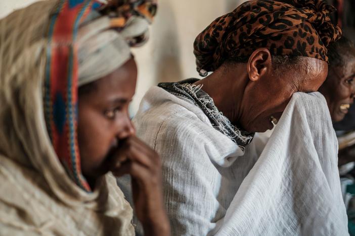 People mourn the victims of a massacre allegedly perpetrated by Eritrean Soldiers, at the house of Beyenesh Tekleyohannes, in the village of Dengolat, North of Mekele, the capital of Tigray. The U.S. announced visa and aid restrictions to Ethiopia due to the months long conflict in the  Tigray region.