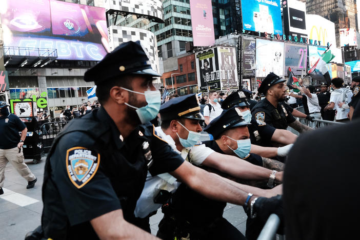 Pro-Palestinian protesters face off with Israel supporters and police last week in Times Square in New York City.