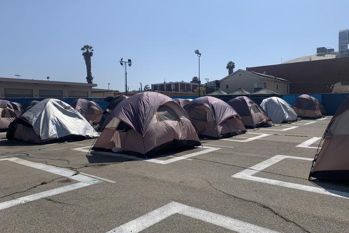 A city-sanctioned encampment for homeless people in Los Angeles includes 70 tents and provides bathrooms, showers and 24-hour security.