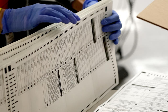 Maricopa County, Ariz., elections officials count ballots on Nov. 4 in Phoenix. Eight years after carving the heart out of a landmark voting rights law, the U.S. Supreme Court put new limits on efforts to combat racial discrimination in voting.
