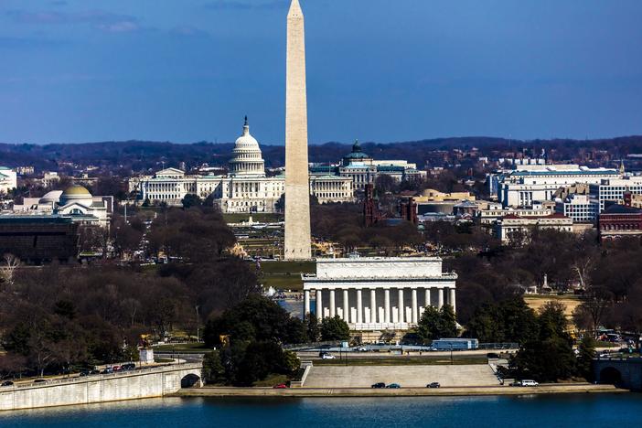 An aerial view of Washington, D.C., shows the Lincoln Memorial and Washington Monument as well as the U.S. Capitol.