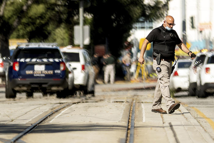 Law enforcement officers respond to a mass shooting at a Santa Clara Valley Transportation Authority facility on Wednesday in San Jose, Calif. A Santa Clara County sheriff's spokesman said the rail yard shooting left multiple people, including the shooter, dead.
