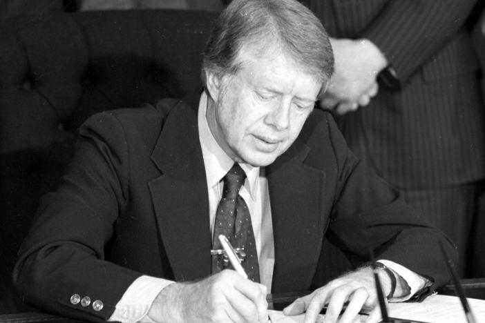 President Jimmy Carter signs emergency natural gas legislation in the Oval Office of the White House in Washington, D.C., on Feb. 2, 1977. An oil crisis contributed to a period of double-digit inflation in the 1970s.